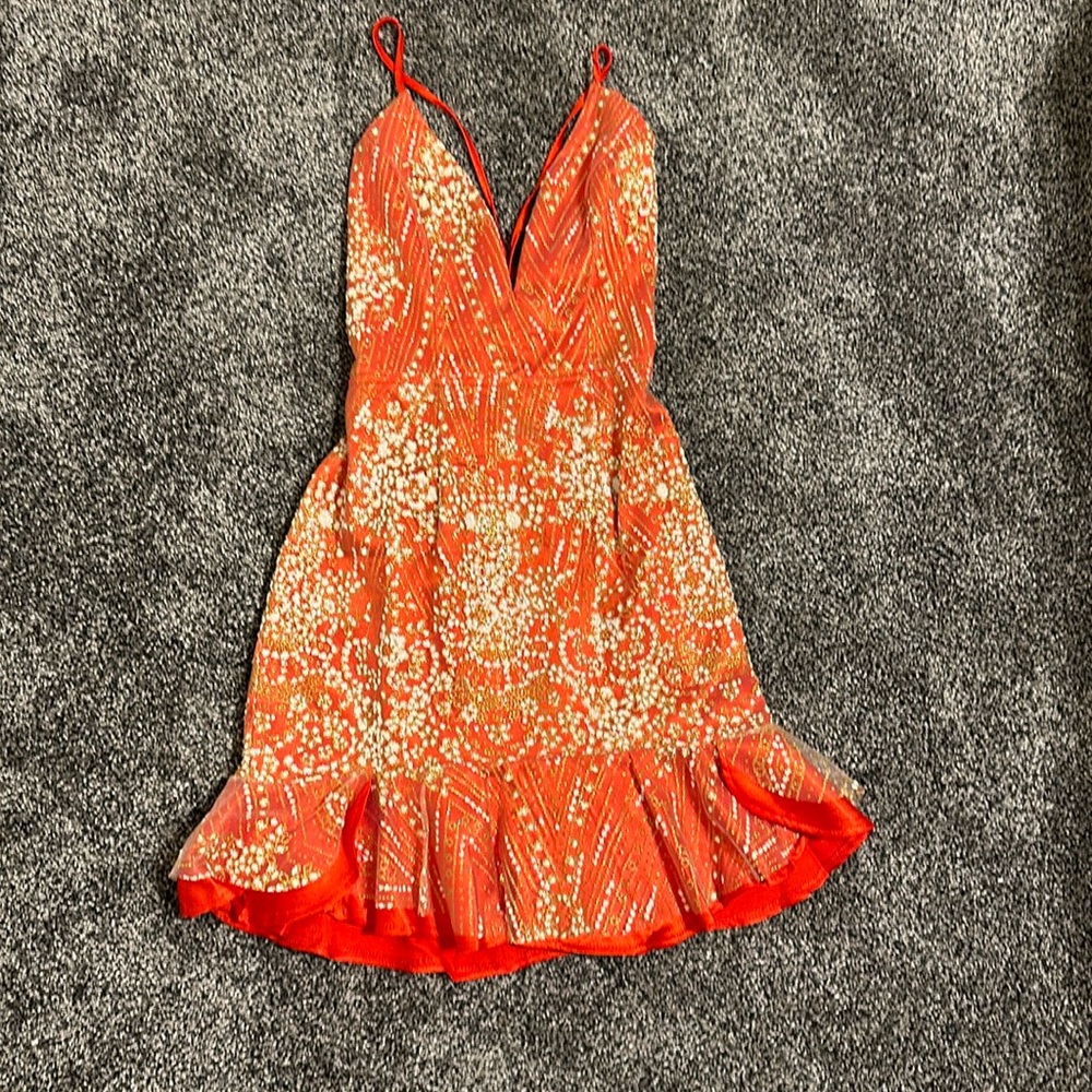 Small embroidered coral dress, short, tight, strappy back